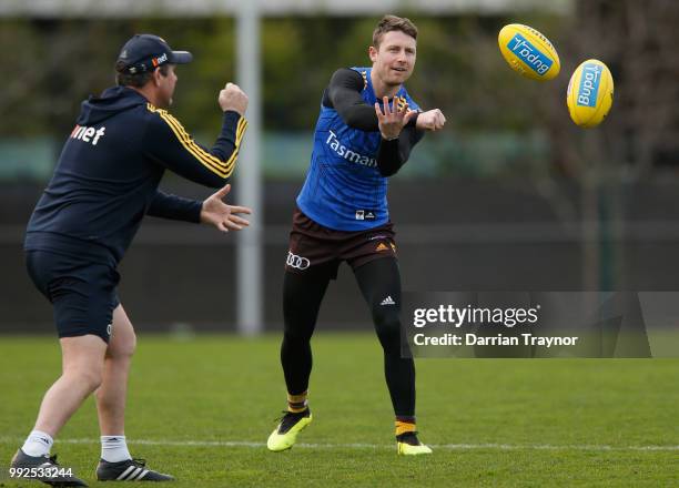 Liam Shiels of the Hawks handballs during a Hawthorn Hawks AFL Training Session at Waverley Park on July 6, 2018 in Melbourne, Australia.