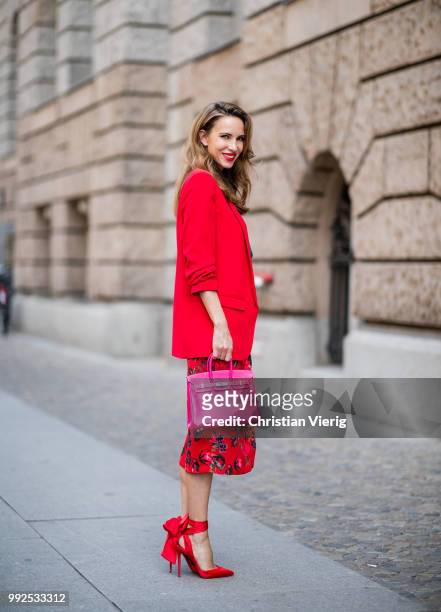 Alexandra Lapp wearing an Asian pencil skirt with a flower print from Zara, a long red Blazer with cropped sleeves from Zara, a green silk top from...