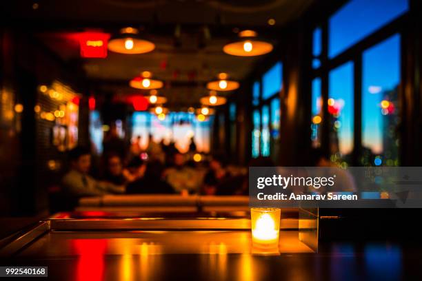 candlelight - blurred motion restaurant stock-fotos und bilder