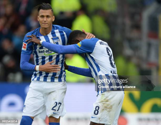 Berlin's Davie Selke comforting Salomon Kalou after his first missed penalty kick during the German Bundesliga soccer match between SC Freiburg and...