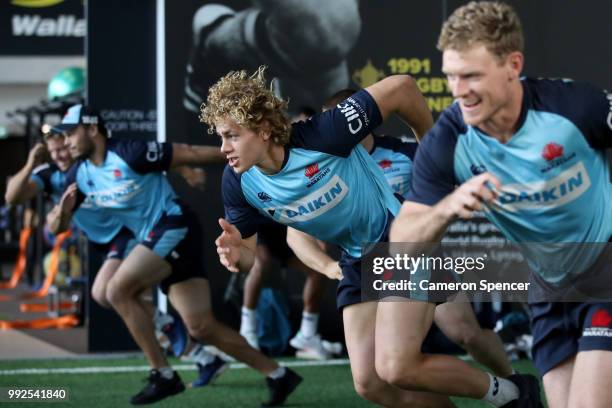 Ned Hanigan of the Waratahs and team mates perform a drill during a Waratahs Super Rugby training session at Allianz Stadium on July 6, 2018 in...