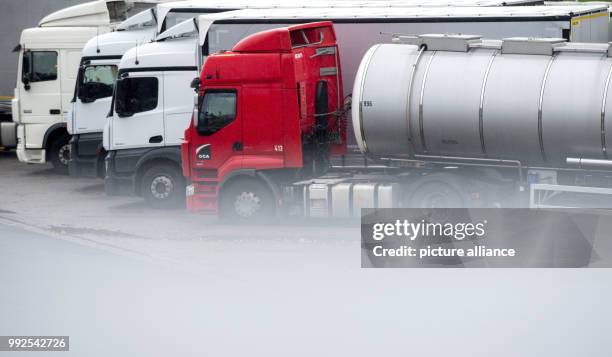 Several trucks can be seen at the rest area along the motorway A2 near Lehrte, Germany, 20 October 2017. Photo: Hauke-Christian Dittrich/dpa