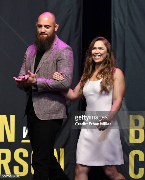 Mixed martial artist Travis Browne walks onstage with his wife Ronda Rousey as she becomes the first female inducted into the UFC Hall of Fame at The...