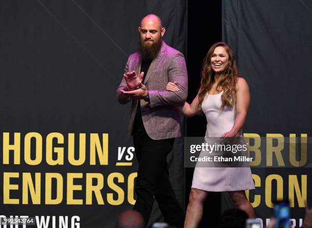 Mixed martial artist Travis Browne walks onstage with his wife Ronda Rousey as she becomes the first female inducted into the UFC Hall of Fame at The...