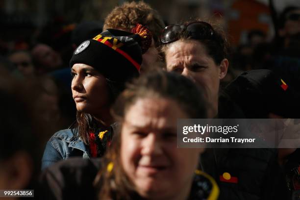 Yoiung woman looks on as thousands of people take part in the NAIDOC march on July 6, 2018 in Melbourne, Australia. The march marks the start of...