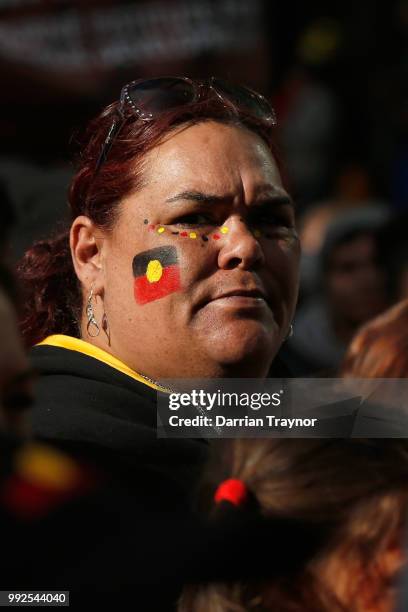 Woman looks on as thousands of people take part in the NAIDOC march on July 6, 2018 in Melbourne, Australia. The march marks the start of NAIDOC...