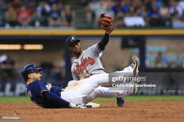 Atlanta Braves second baseman Ozzie Albies shows the ball to the umpire on a pick off play of Milwaukee Brewers left fielder Ryan Braun during a game...