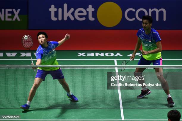 Tontowi Ahmad and Liliyana Natsir of Indonesia compete against Zhang Nan and Li Yinhui of China during the Mixed Doubles Quarter-final match on day...