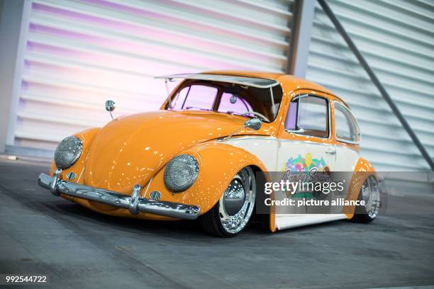 Dpatop - A tuned VW Beetle 1969 can be seen under colorful light in Essen, Germany, 23 October 2017. The 50th Essen Motor Show starts on the 1st of...