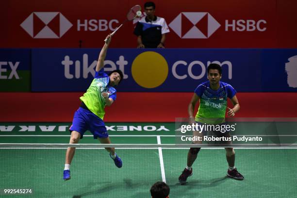 Tontowi Ahmad and Liliyana Natsir of Indonesia compete against Zhang Nan and Li Yinhui of China during the Mixed Doubles Quarter-final match on day...