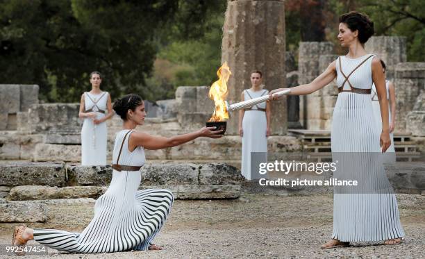 Dpatop - An actrees performs the role of the high priestess of the Temple of Hera lights the Olympic flame during during the Lighting Ceremony of the...