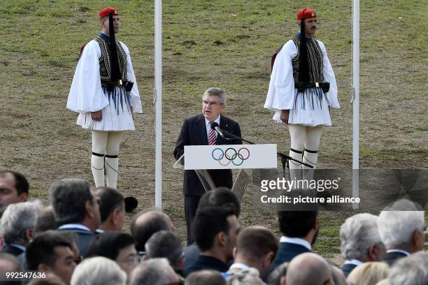 President Thomas Bach gives a talk at the ceremonial lighting of the olympic torch in Olympia, Greece, 24 October 2017. The South Korean city of...