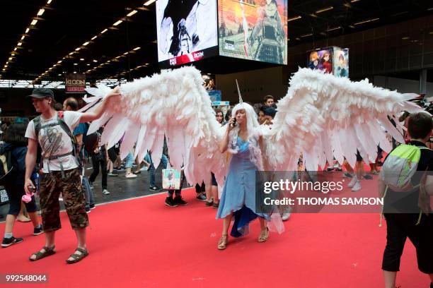 Cosplayer wears a winged costume as she arrives for the 2018 Japan Expo exhibition on July 5, 2018 in Villepinte, near Paris.