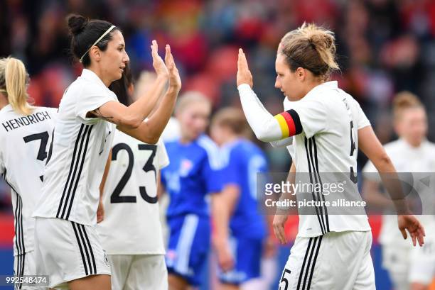 Germany's Babett Peter and Sara Doorsoun celebrating Peter's scoring of the 4:0 during the World Cup qualifier soccer game between Germany and the...