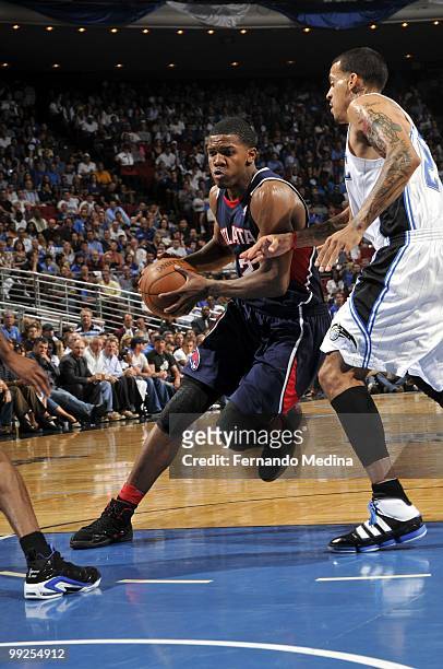 Joe Johnson of the Atlanta Hawks drives to the basket against Matt Barnes of the Orlando Magic in Game Two of the Eastern Conference Semifinals...