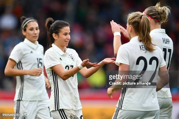 Germany's Sara Doorsoun , scorer Hasret Kayikci, Tabea Kemme and Alexandra Popp celebrating the 8:0 during the World Cup qualifier soccer game...