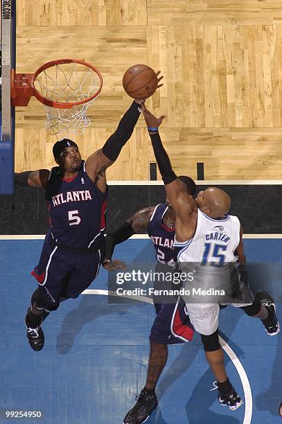 Josh Smith of the Atlanta Hawks goes up to block a shot by Vince Carter of the Orlando Magic in Game Two of the Eastern Conference Semifinals during...