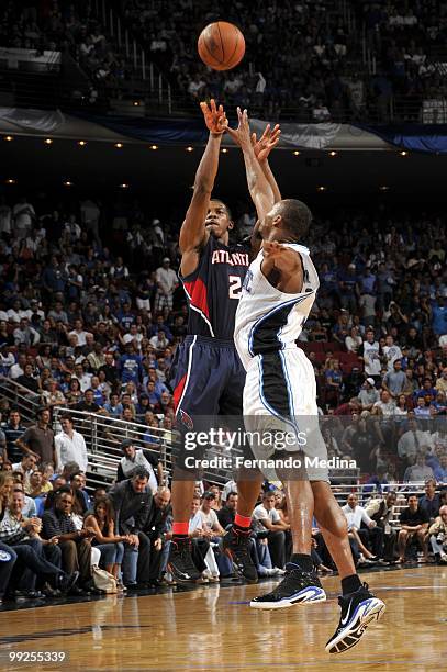 Joe Johnson of the Atlanta Hawks shoots a jump shot against Rashard Lewis of the Orlando Magic in Game Two of the Eastern Conference Semifinals...