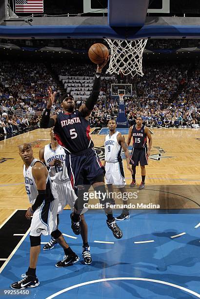 Josh Smith of the Atlanta Hawks shoots a layup against Vince Carter of the Orlando Magic in Game Two of the Eastern Conference Semifinals during the...