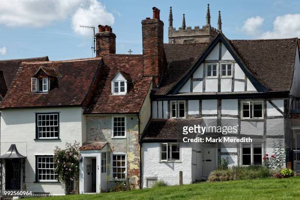 medieval houses and church in marlborough in wiltshire, england - marlborough house stock pictures, royalty-free photos & images