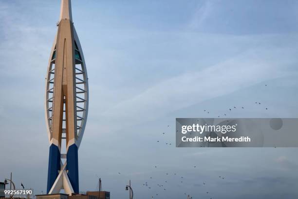emirates spinnaker tower and flock of birds, dawn, portsmouth, hampshire, england - spinnaker tower stock pictures, royalty-free photos & images