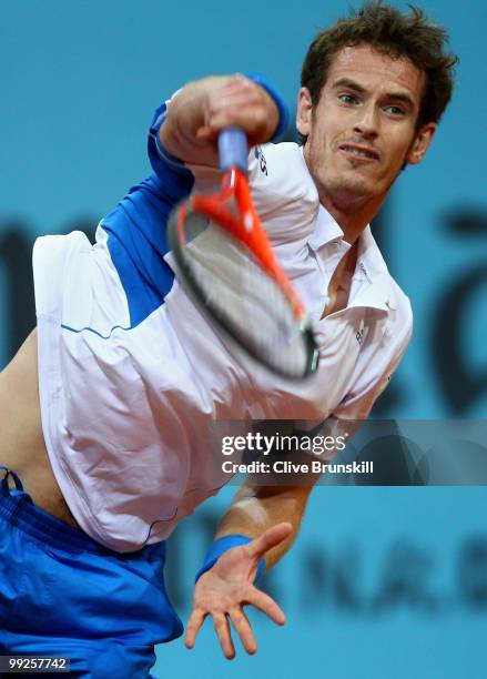Andy Murray of Great Britain serves the ball to Victor Hanescu of Romania in their third round match during the Mutua Madrilena Madrid Open tennis...