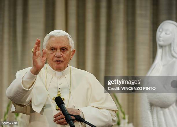 Pope Benedict XVI blesses during a meeting with Portuguese bishops in Fatima on May 13, 2010. Half a million people flocked to a giant mass with Pope...