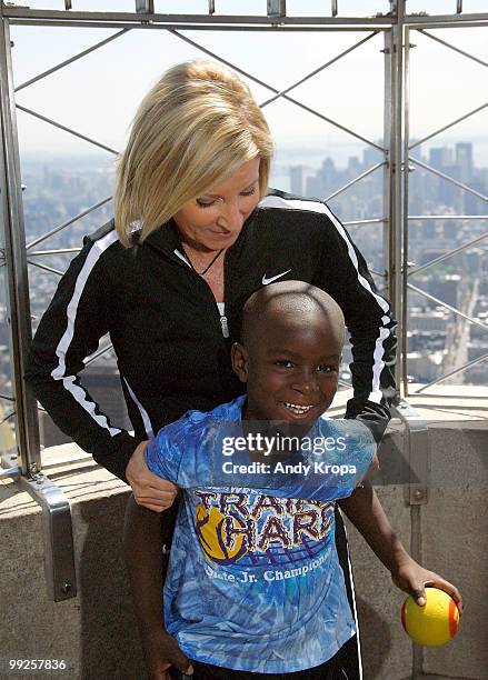 Chris Evert and children from the Harlem Junior Tennis and Education Program celebrate National Tennis Month at The Empire State Building on May 13,...