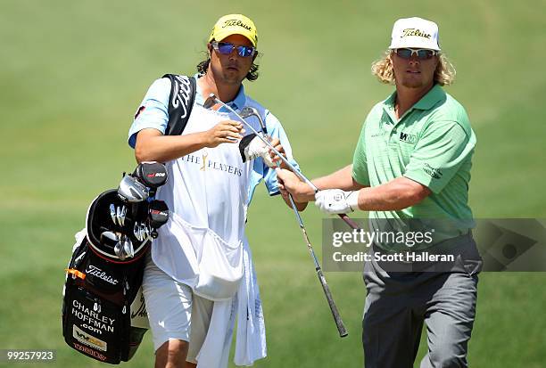 Charley Hoffman switches clubs with his caddie during the final round of THE PLAYERS Championship held at THE PLAYERS Stadium course at TPC Sawgrass...