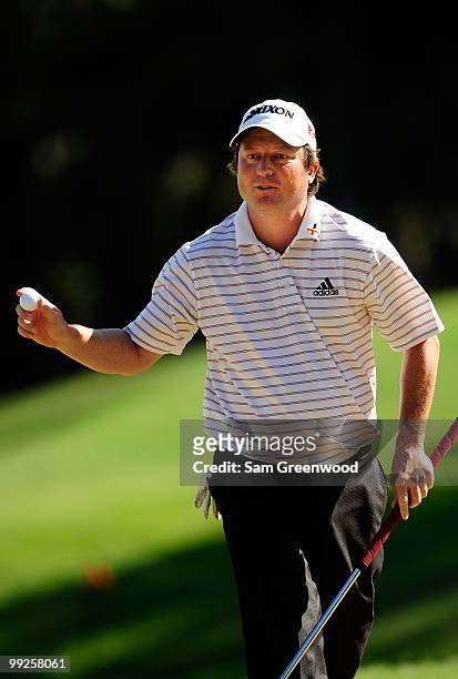 Tim Clark of South Africa waves to fans after making birdie on the 12th hole during the final round of THE PLAYERS Championship held at THE PLAYERS...