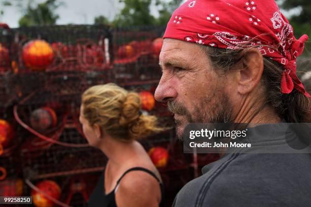 Crab trap builder Shawn Platt looks over his idle traps in on May 13, 2010 in Hopedale, Louisiana. The traps were all pulled from the Gulf waters...