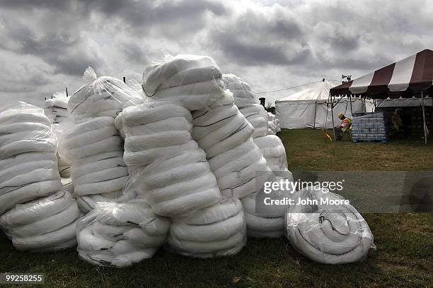 Oil absorbing booms sit ready to be used to protect marshlands in the Gulf of Mexico on May 13, 2010 in Hopedale, Louisiana. The BP Deepwater Horizon...