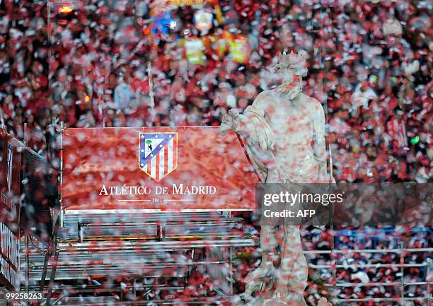 Atletico de Madrid's football players gather at the Neptune fountain in the center of Madrid on May 13, 2010 to celebrate with Atletico Madrid...