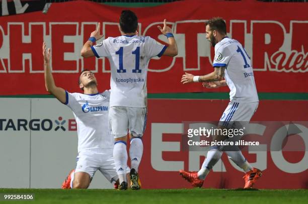 Schalke's Franco Di Santo celebrates with team mates Jewgeni Konopljanka and Guido Burgstaller after scoring during the German DFB Pokal soccer cup...