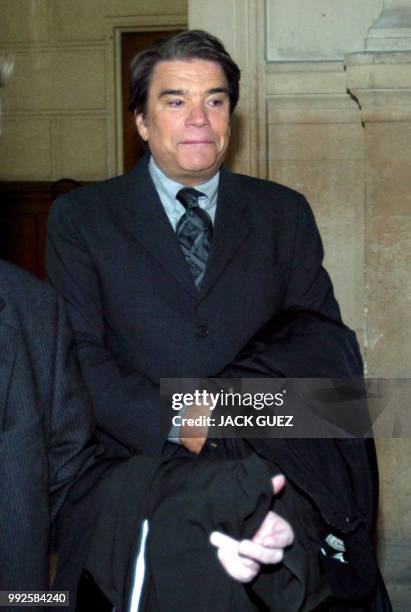 Bernard Tapie arrive au tribunal correctionnel de Paris, le 10 mars 2004. Le fisc lui reproche d'avoir utilisé personnellement, en 1993-1994, le...