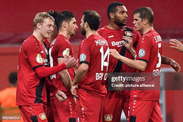 Dpatop - Leverkusen's Julian Brandt celebrates with team mates after scoring during the German DFB Pokal soccer cup match between Bayer Leverkusen...