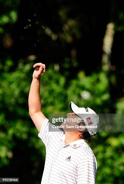 Tim Clark of South Africa checks the wind before playing a shot on the tenth fairway during the final round of THE PLAYERS Championship held at THE...