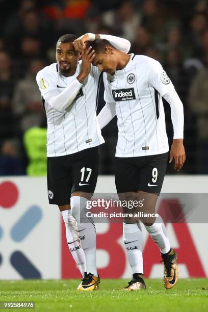 Frankfurt's Sebastien Haller celebrating with teammate Kevin-Prince Boateng after scoring the opening goal during the DFB Cup soccer match between...