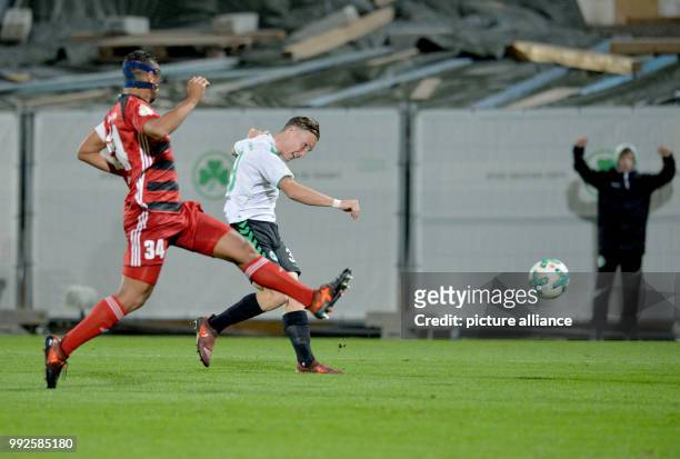 Furth's David Raum scores 1-0 next to Ingolstadt's Marvin Matip during the DFB Cup soccer match between SpVgg Greuther Furth and FC Ingolstadt 04 in...