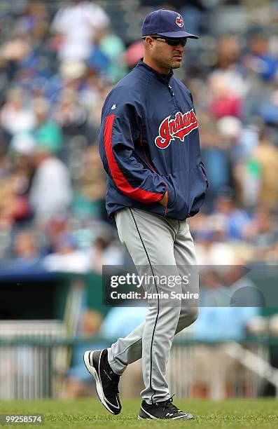 Manager Manny Acta of the Cleveland Indians walks back from a mound conference during the game against the Kansas City Royals on May 13, 2010 at...