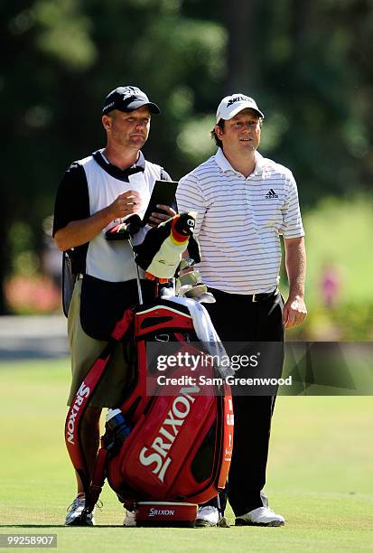 Caddie Steve Underwood and Tim Clark talk during the final round of THE PLAYERS Championship held at THE PLAYERS Stadium course at TPC Sawgrass on...