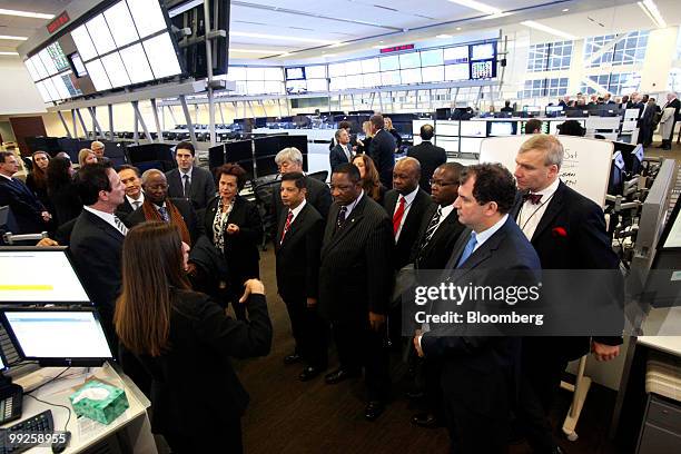 Various foreign diplomats tour the CME Group Inc.'s new Global Command Center technology facility in Chicago, Illinois, U.S., on Thursday, May 13,...