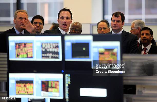 Various foreign diplomats tour the CME Group Inc.'s new Global Command Center technology facility in Chicago, Illinois, U.S., on Thursday, May 13,...