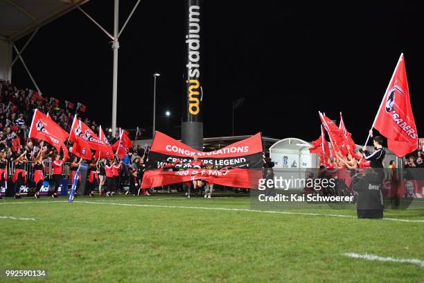 Wyatt Crockett of the Crusaders runs out for his 200th Super Rugby match prior to the round 18 Super Rugby match between the Crusaders and the...