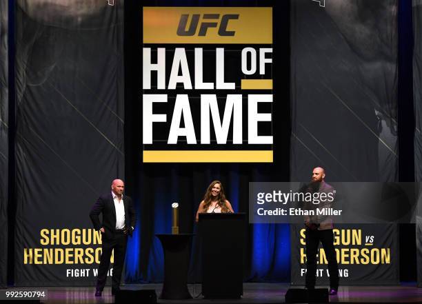 Ronda Rousey , flanked by UFC President Dana White and her husband, mixed martial artist Travis Browne , speaks as she becomes the first female...