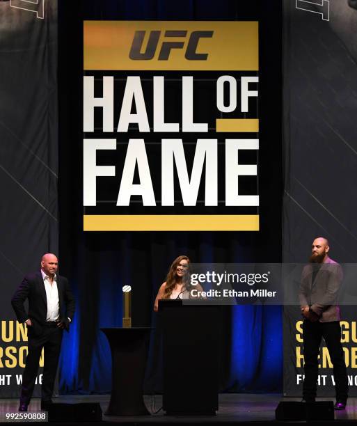 Ronda Rousey , flanked by UFC President Dana White and her husband, mixed martial artist Travis Browne , speaks as she becomes the first female...