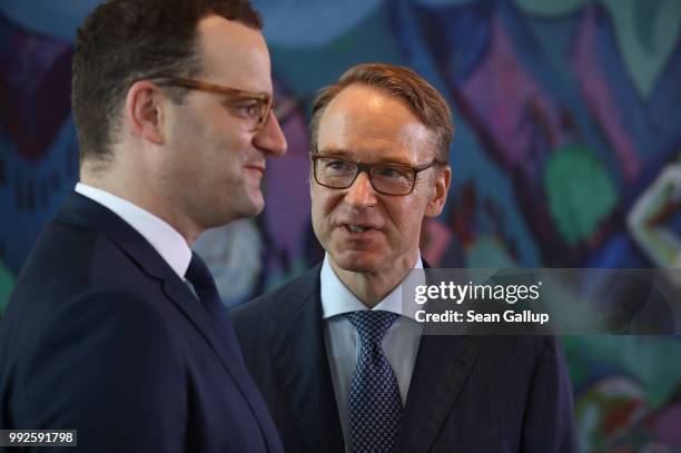 Jens Weidmann , President of the Bundesbank, and Health Minister Jens Spahn attend the weekly German government cabinet meeting on July 6, 2018 in...