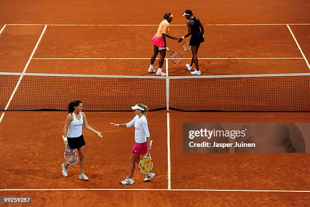 Agnieszka Radwanska of Poland and Maria Kirilenko of Russia celebrate a point in their quarter final doubles match against Serena Williams and Venus...