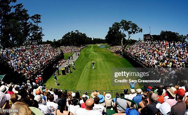 Zach Johnson plays his tee shot on the first hole as Phil Mickelson looks on during the final round of THE PLAYERS Championship held at THE PLAYERS...