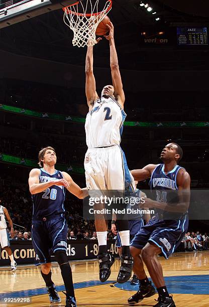 Shaun Livingston of the Washington Wizards goes up for the dunk against Kyle Korver and Paul Millsap of the Utah Jazz during the game at the Verizon...